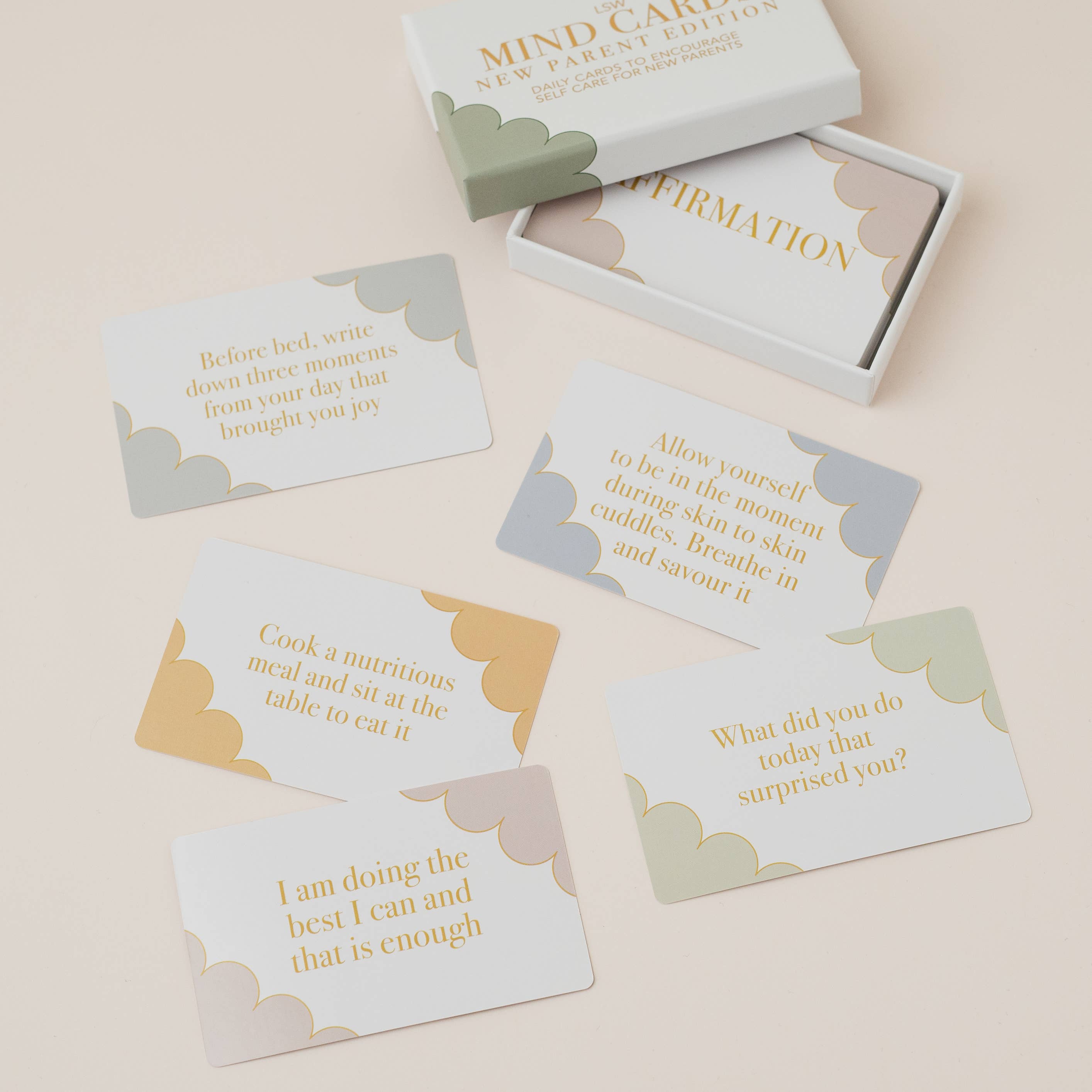 Set of mind cards with motivational phrases in a box on a beige background