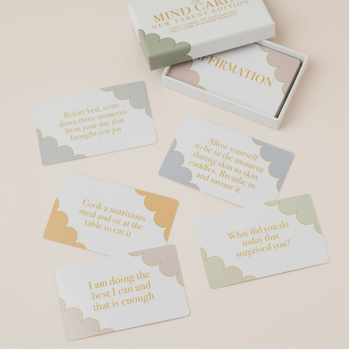 Set of mind cards with motivational phrases in a box on a beige background