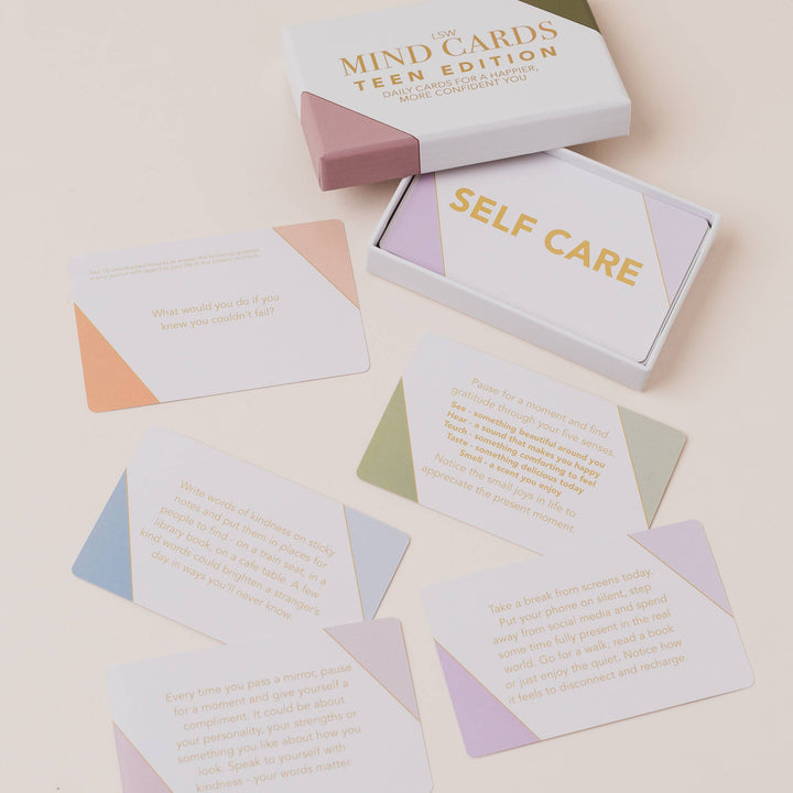 Mind cards packaging with 'Self Care' cards on a light beige background