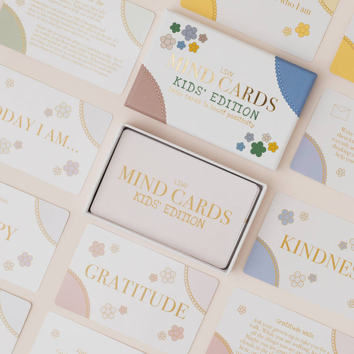Set of 'Mind Cards Kids' Edition' with cards and a box on a light background