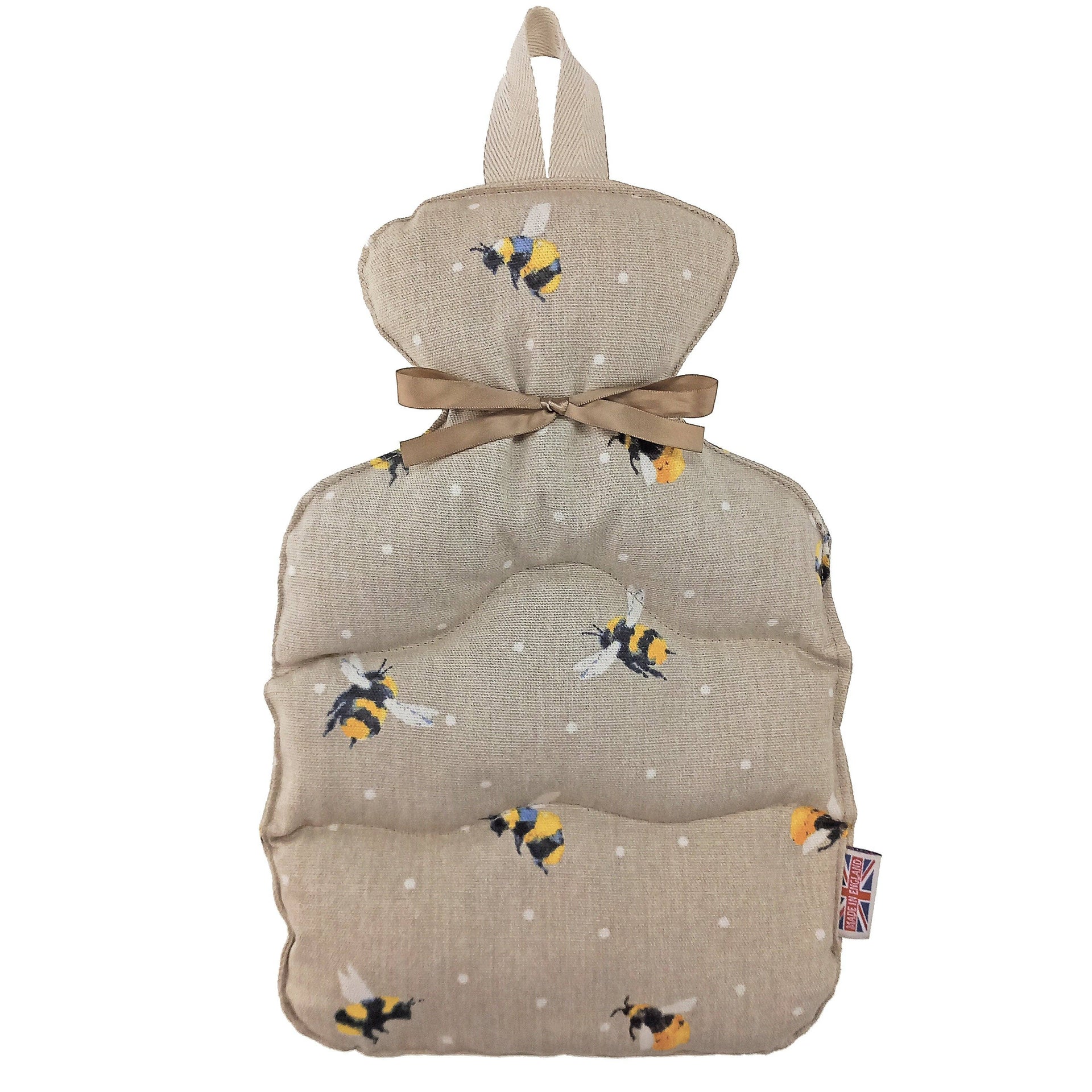Wheat bottle with bee pattern and brown ribbon on a white background