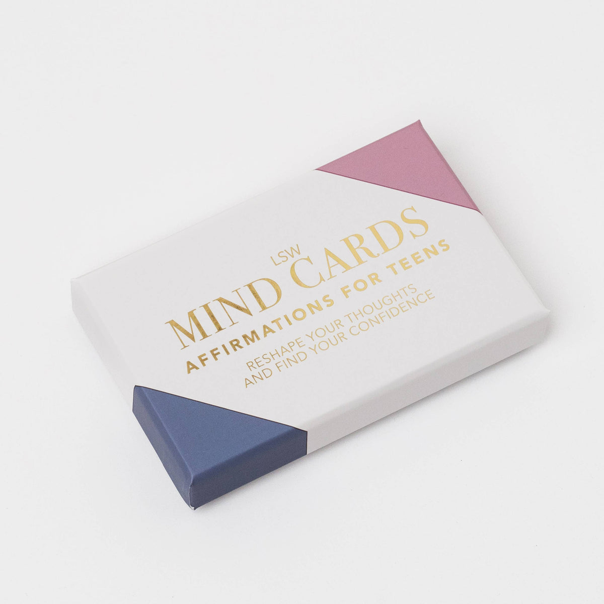 LSW Mind Cards affirmation deck box for teens, featuring a white box with gold lettering and geometric pink and navy blue corner accents, photographed on a clean white background.