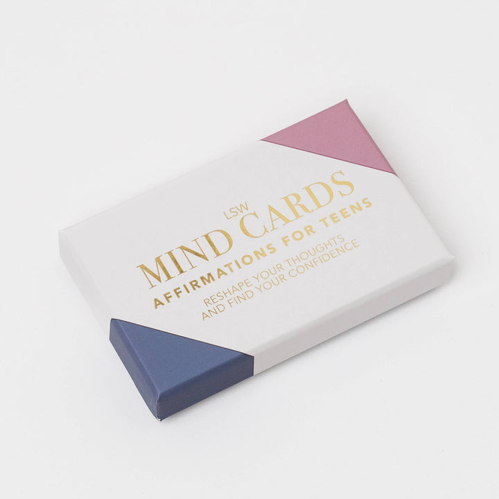 LSW Mind Cards affirmation deck box for teens, featuring a white box with gold lettering and geometric pink and navy blue corner accents, photographed on a clean white background.