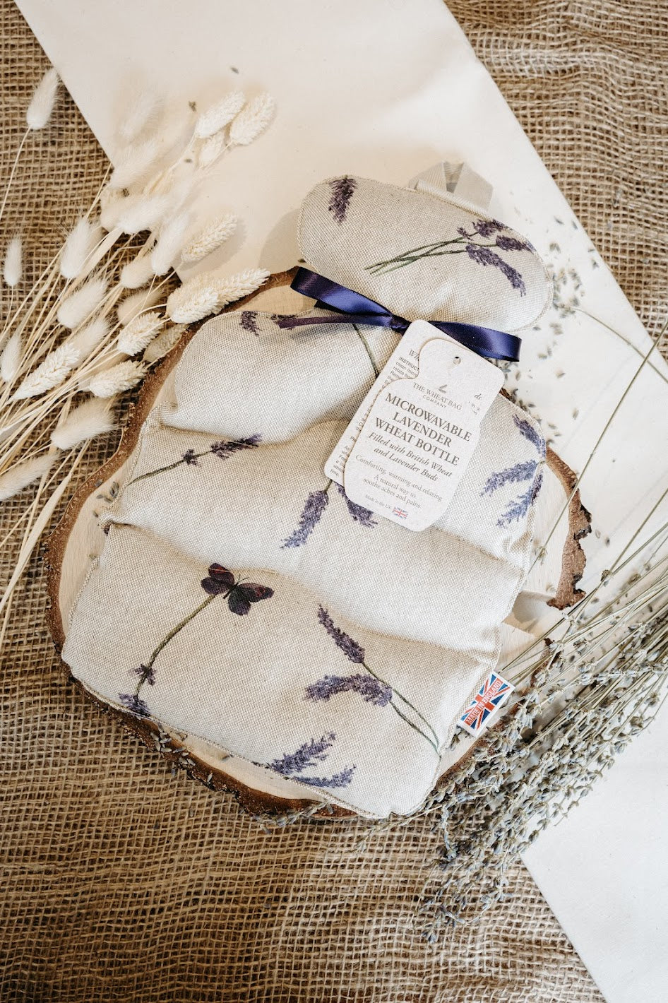 Lavender wheat bottle with lavender design on a textured surface