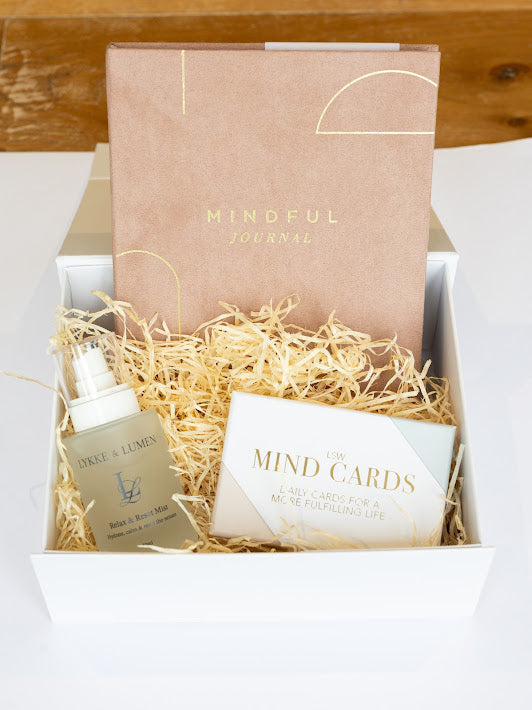 Lykke & Lumen wellness gift set featuring Relax & Reset Mist, mindfulness cards and a mindful journal presented in a luxury self-care gift box with calming natural styling.