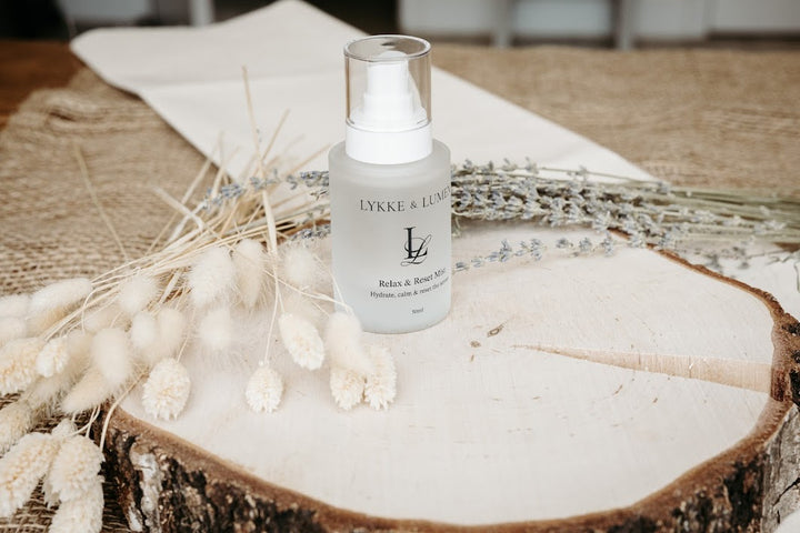 Lykke & Lumen Relax & Reset Mist hydrating face and pillow mist styled with dried lavender in a calming wellness setting