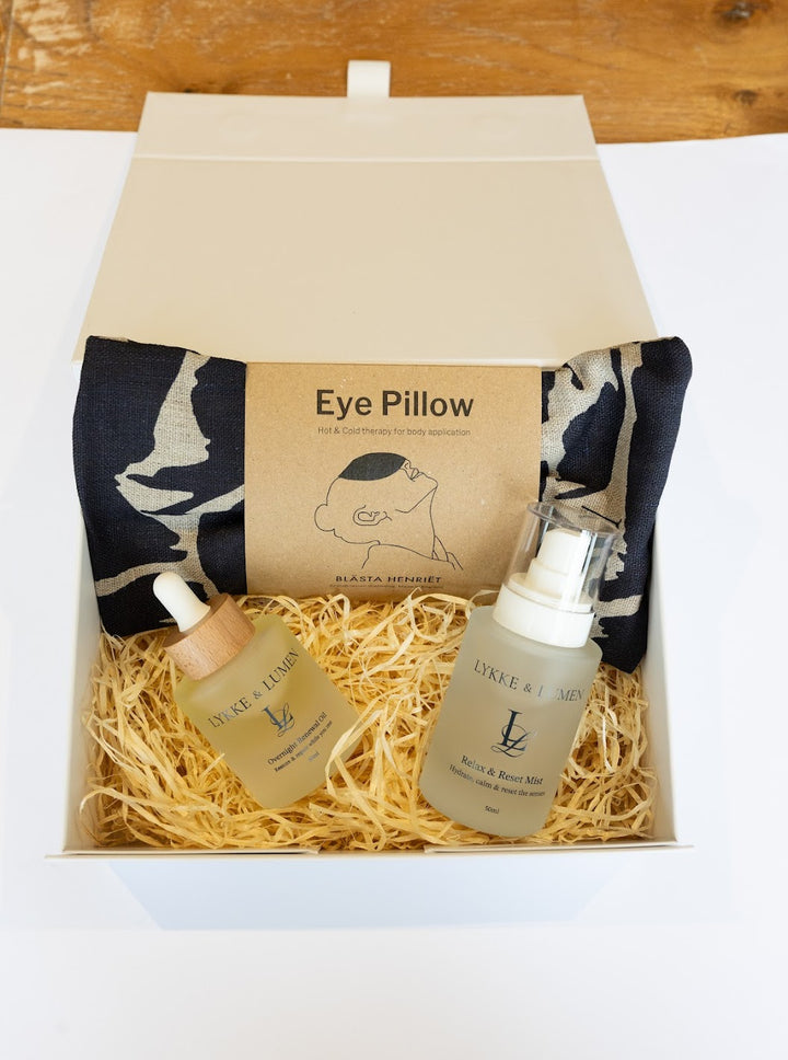 Lykke & Lumen self-care gift set featuring Overnight Renewal Oil, Relax & Reset Mist and a soothing eye pillow in a luxury wellness gift box designed for rest and relaxation.