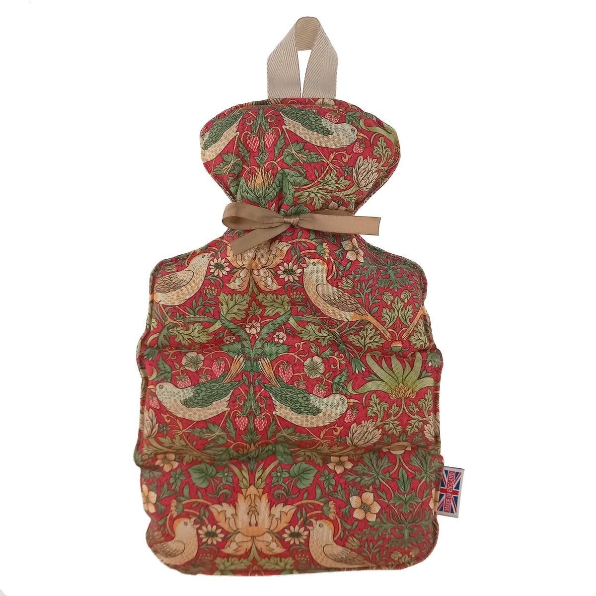 A vintage-style hot water bottle cover featuring a William Morris red and green floral pattern with birds, tied with a beige ribbon and shown on a white background.