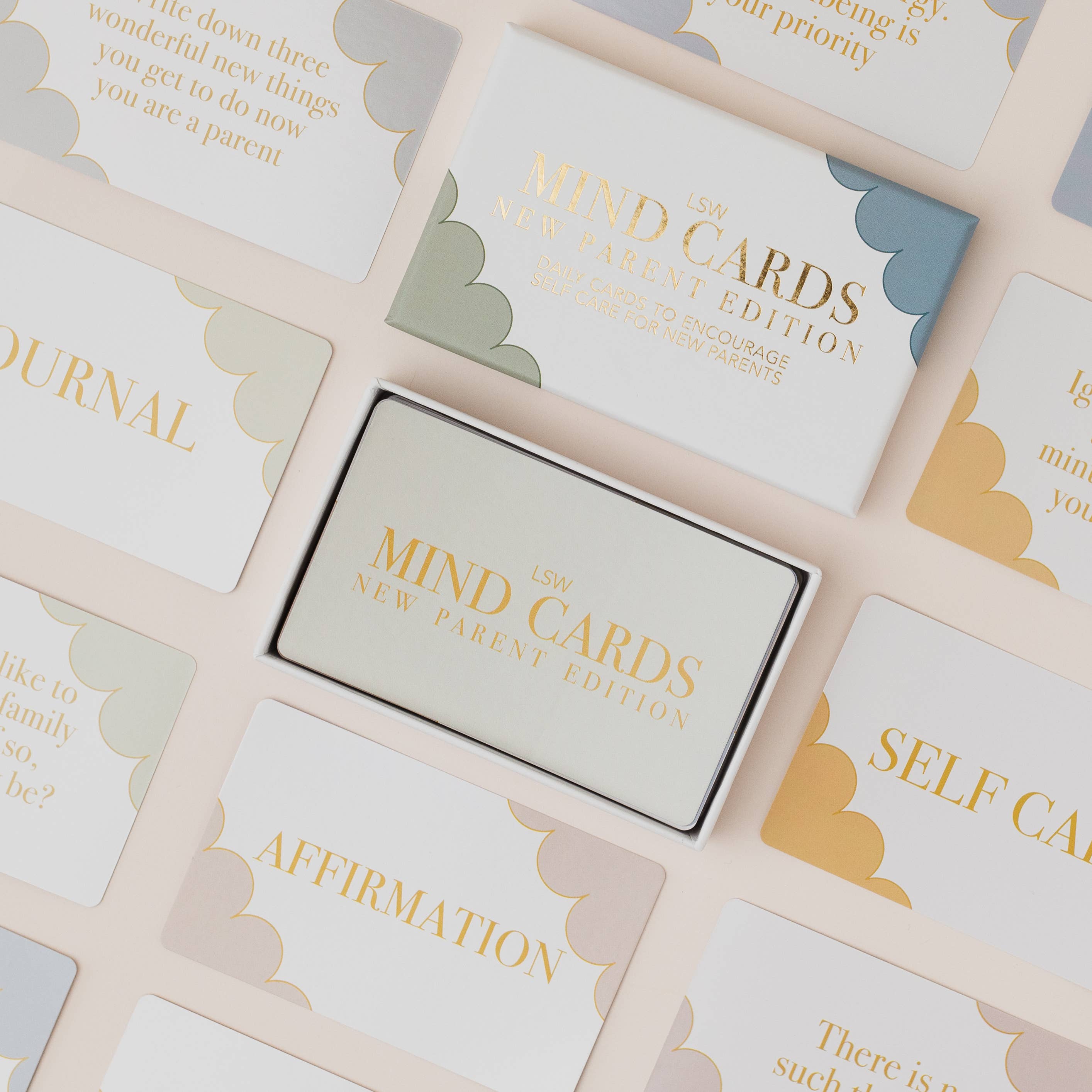 Mind Cards packaging surrounded by cards with text on a light background