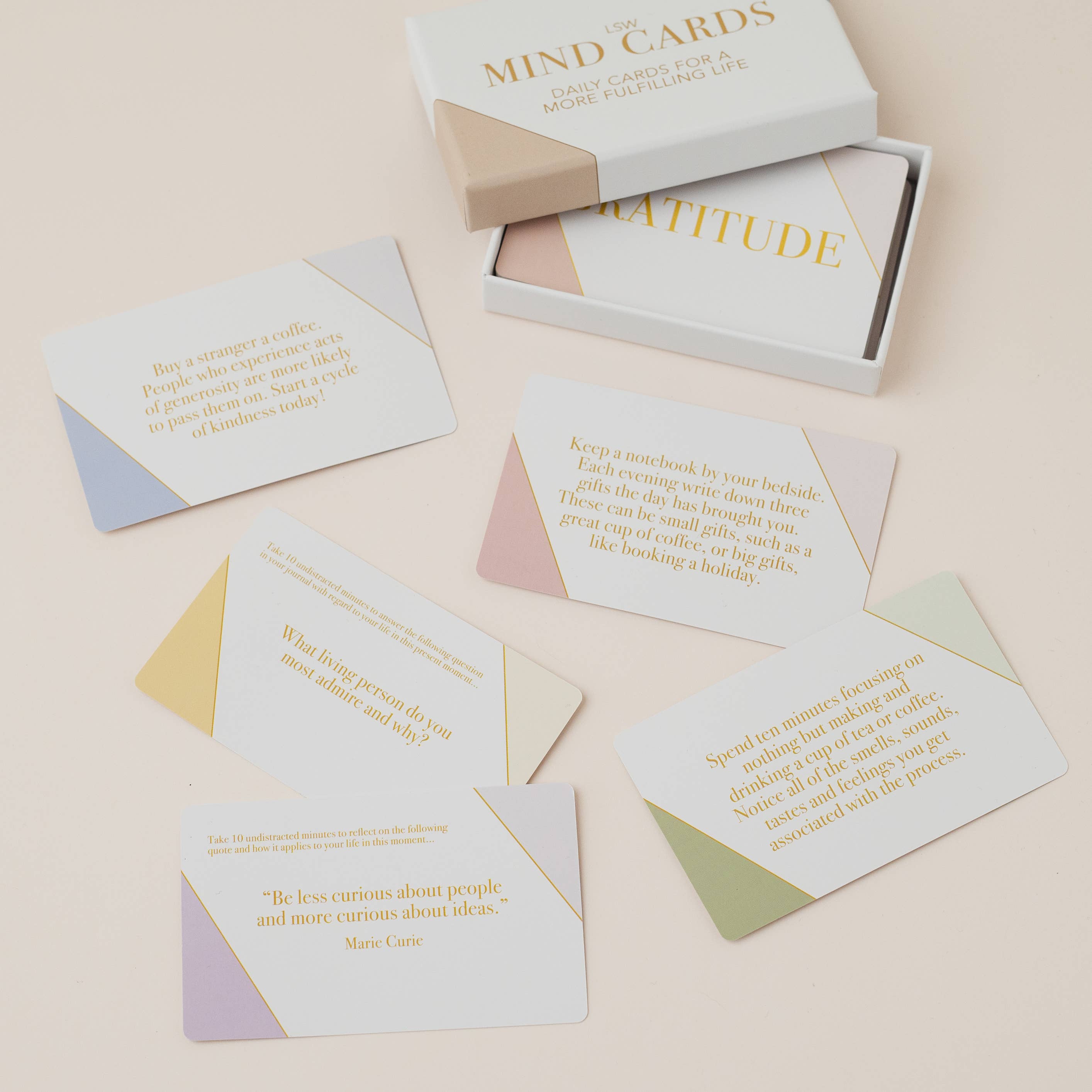 Gratitude mindcards spread across a light pink surface
